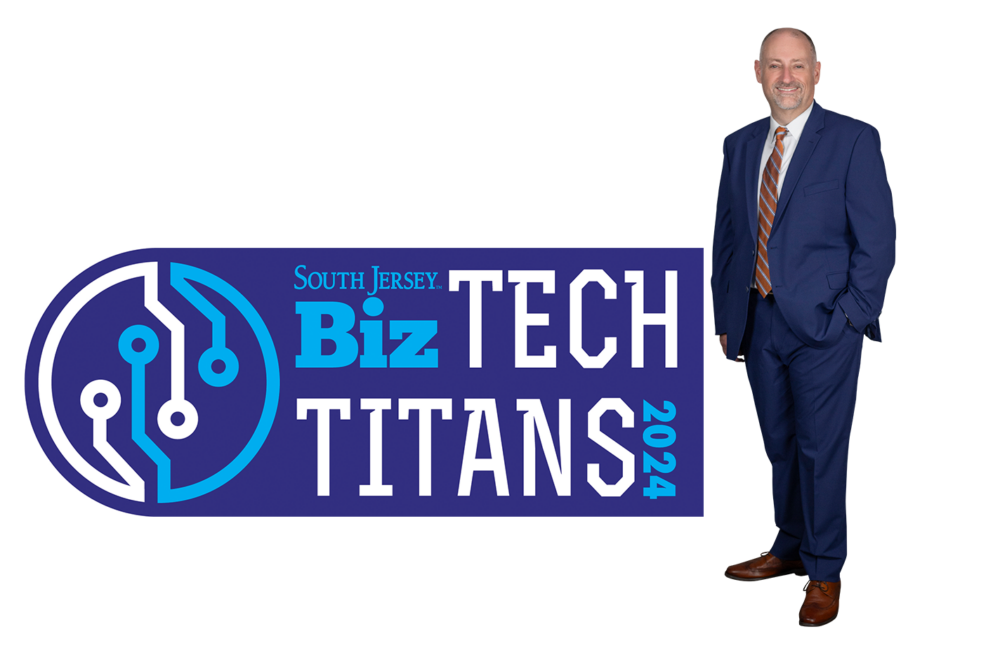 Darren Crane next to the Tech Titan badge