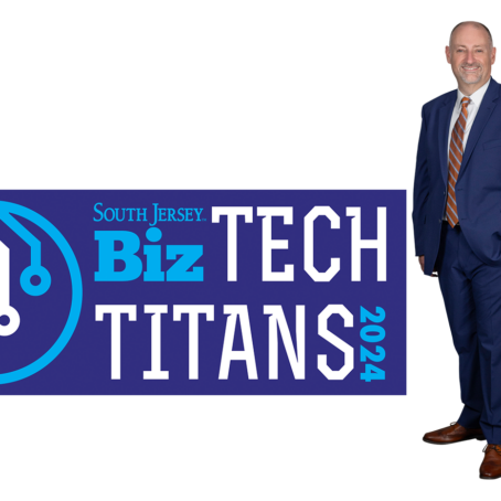 Darren Crane next to the Tech Titan badge